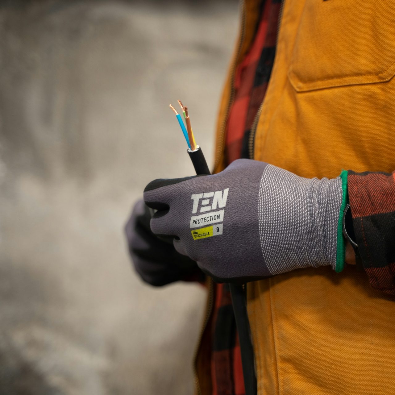 Electrician inspecting electrical wires during installation or repair work.