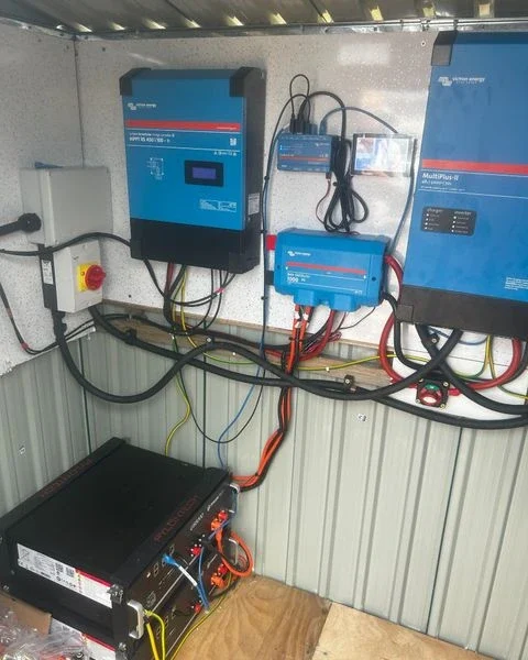 Victron Energy off-grid solar battery and inverter installation with charge controllers and power management system.